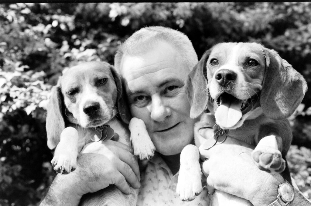 Thraphes Bryant, in addition to being White House electrician, helped care for the beagles of Lyndon B. Johnson, 1964.